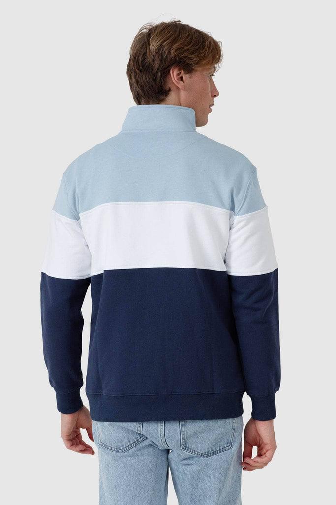 Back of quarter zip jumper with light blue top panel, white middle panel and navy bottom panel