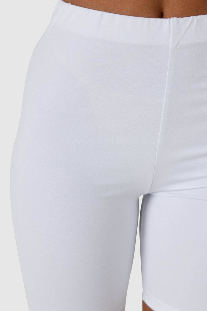 Close up of waistband of white bike shorts.