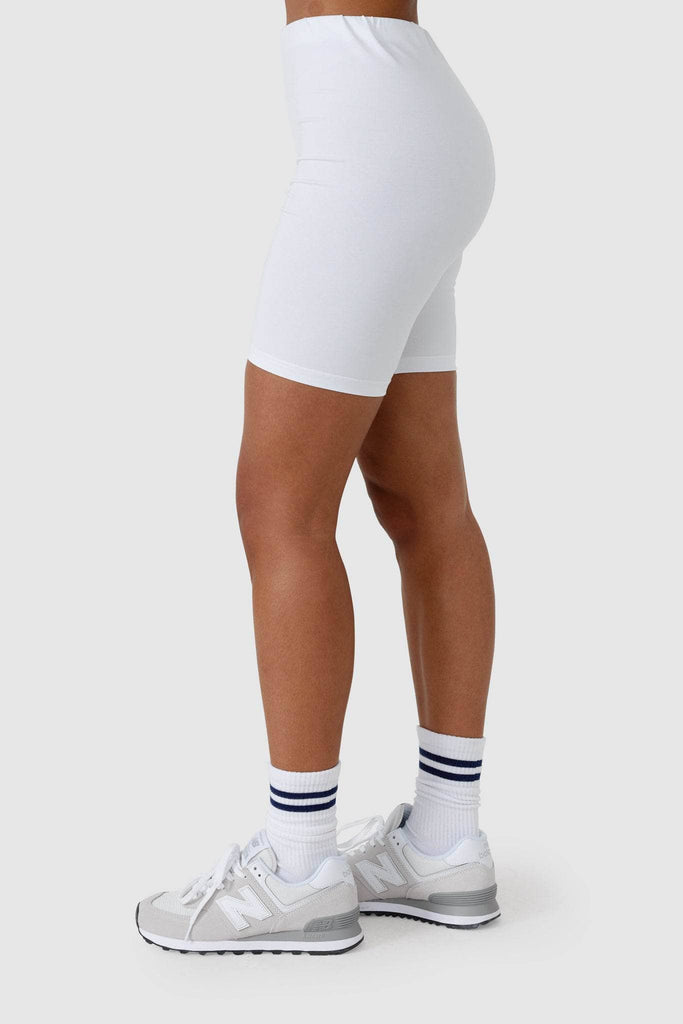 Side view of womens white bike shorts.