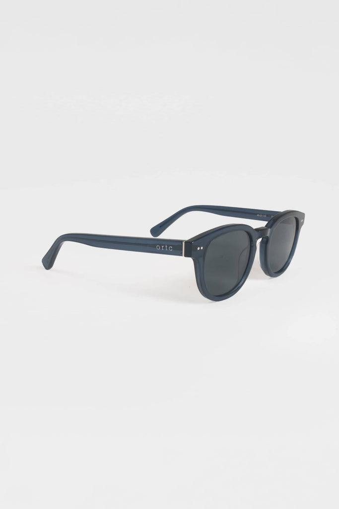 Clear navy blue sunglasses with ortc on arm
